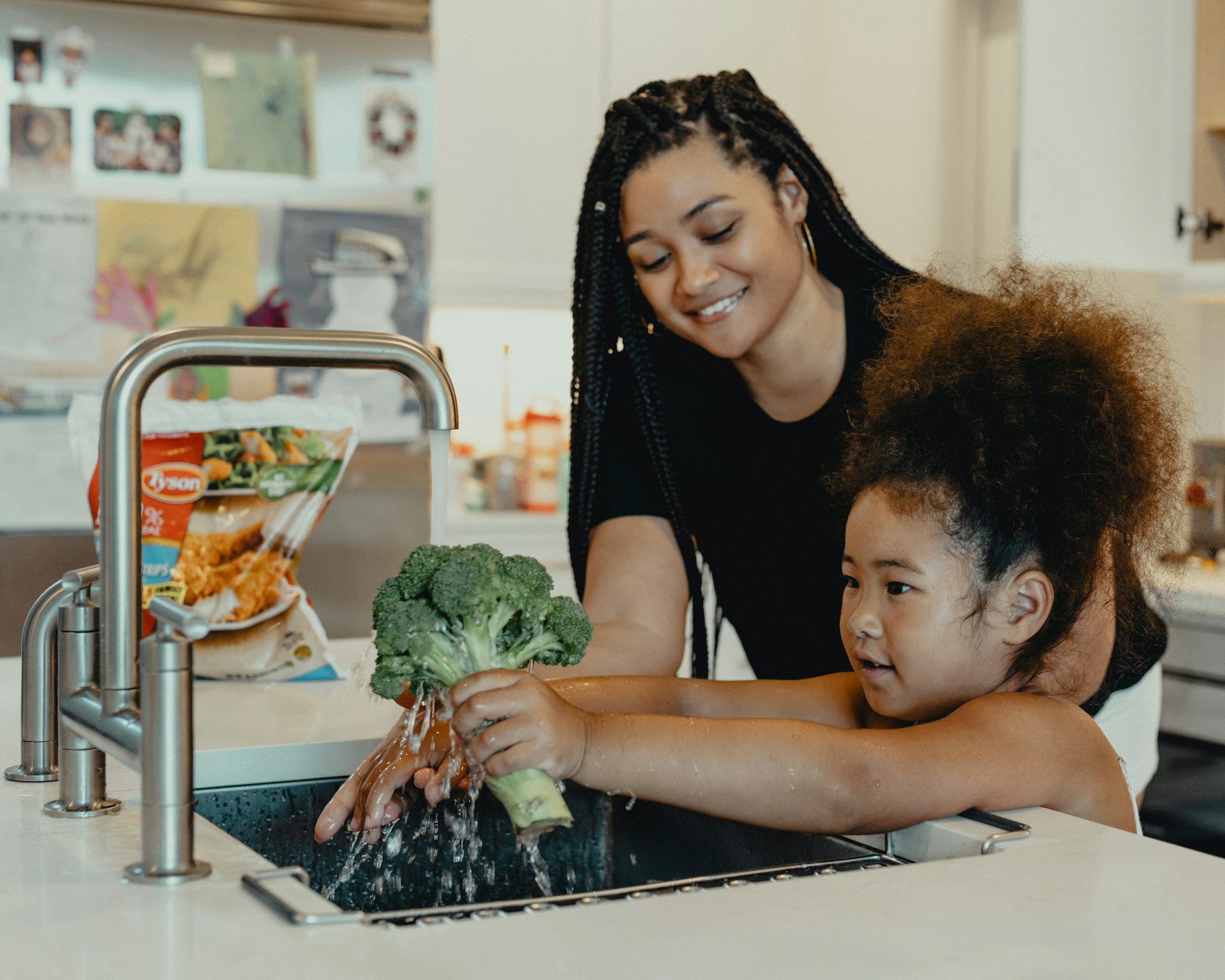 washing broccoli in the sink