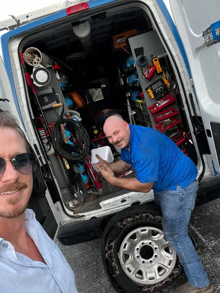 24/7 Emergency Plumbing & HVAC Services 6 Technician performing maintenance on a residential generator for power reliability